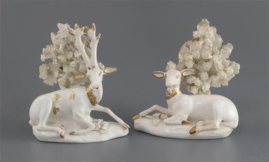 A pair of Derby gilt and white porcelain figures of deer, c.1810-30, H. 9.3cm